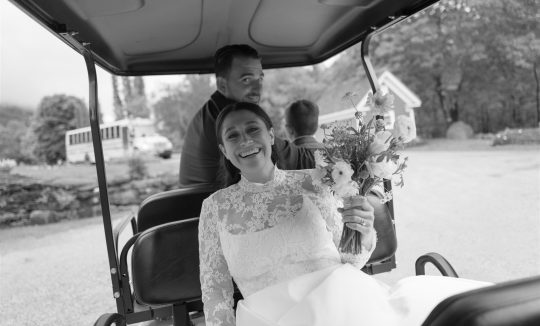 Wedding transportation at Riverside Farm Vermont with golf cart and shuttle bus