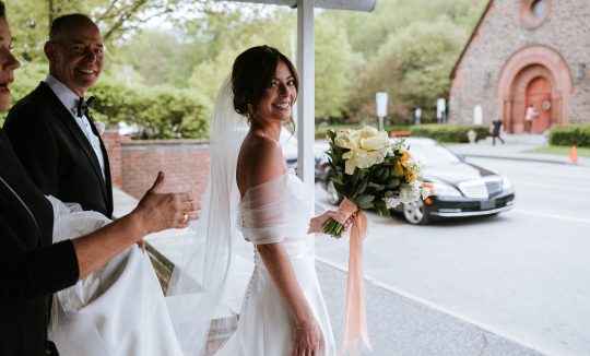 Wedding transportation at Woodstock Inn Vermont with bride crossing street